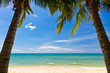 Sand beach with palms and canoes in Phu Quoc, Vietnam