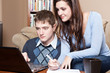 Foto: Couple paying bills by online banking Couple paying bills by online banking