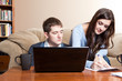 Foto: Couple paying bills by online banking Couple paying bills by online banking