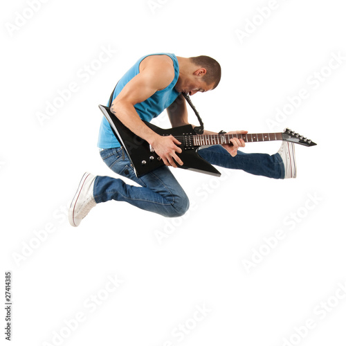 Photo: guitarist jumps in the air guitarist jumps in the air