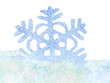 Snowflake in snow. Isolated.