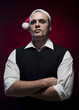 Photo: Horror Christmas Elf. Makeup and blood splash on his face. Horror Christmas Elf. Makeup and blood splash on his face.