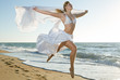 Woman jumping on the beach Woman jumping on the beach