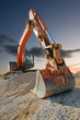 Orange coloured heavy construction digger Orange coloured heavy construction digger