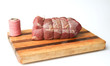 Roastbeef on cutting board with cord