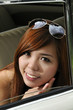 girl inside antique car with sun glasses