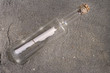 message in a bottle in the sand