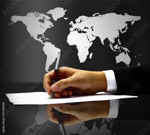 Photo: businessman's hand with pen businessman's hand with pen