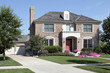 Brick home with front balcony