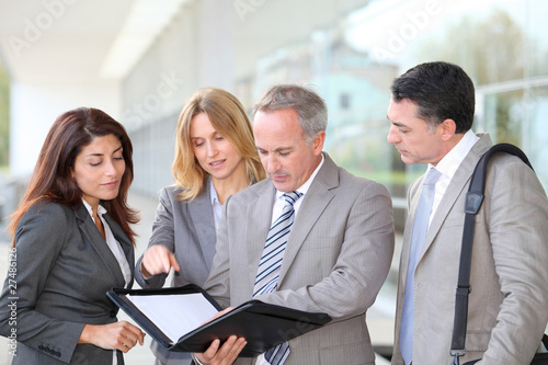 Photo: Business people meeting at an exhibition Business people meeting at an exhibition