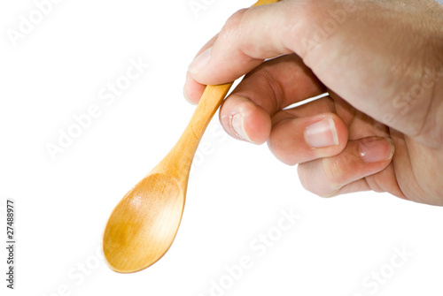 Photo: mano con cucchiaio mano con cucchiaio
