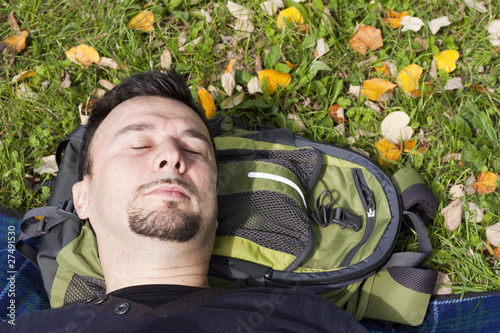 Photo: Young Adult Relaxing in the Park during a Weekend Afternoon Young Adult Relaxing in the Park during a Weekend Afternoon
