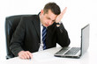 Stressed businessman sitting at desk Stressed businessman sitting at desk