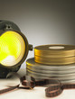 Long live the cinema! Filmstrip, cans and fresnel light