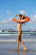 young  woman dancing with kerchief against the blue sky