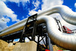 Industrial zone, Steel pipelines and valves against blue sky Industrial zone, Steel pipelines and valves against blue sky