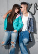 Young couple urban fashion standing portrait