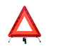 Photo: Red plastic warning triangle isolated against a white background Red plastic warning triangle isolated against a white background
