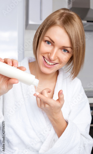Photo: woman using cosmetics woman using cosmetics