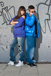 Young couple urban fashion standing portrait