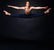 Young ballet man jumping against black background - copyspace Young ballet man jumping against black background - copyspace
