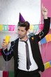 Happy party young man drinking enjoying alone