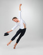 Stylish male dancer performing against white - copyspace Stylish male dancer performing against white - copyspace