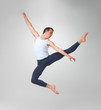 Male ballet dancer performing against white background Male ballet dancer performing against white background