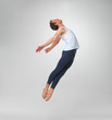 Male ballet dancer leaping against white background - copyspace Male ballet dancer leaping against white background - copyspace