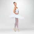Beautiful ballerina dancing against white background