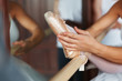 Ballerina's foot practicing at ballet bar