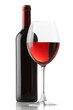 Glass of red wine and a bottle isolated over white background