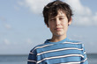 Young boy squinting