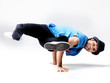 Street performer - Young male breakdancer performing bboying stu Street performer - Young male breakdancer performing bboying stu