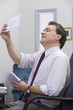 Businessman looking at his mail