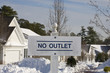 No Outlet sign at end of suburb street in winter