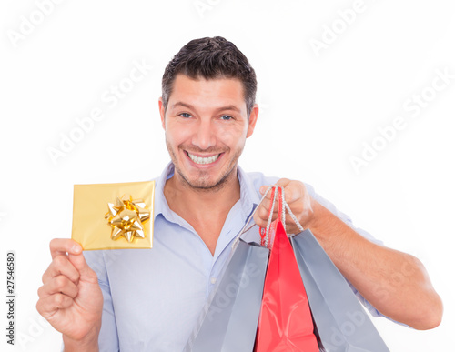 Photo: shopping man with bags and bonus card shopping man with bags and bonus card