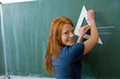 Young Girl Writing on a Blackboard