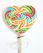 Close up of colourful lollipop, heart shape.
