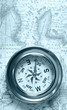 Old compass on ancient map