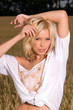 young woman standing on a wheat field young woman standing on a wheat field