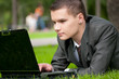 business man work on notebook at park. Student