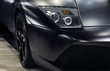 Headlight of a black sports car