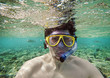 man with a goggles in the sea