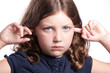 Photo: Sad girl covers ears Sad girl covers ears
