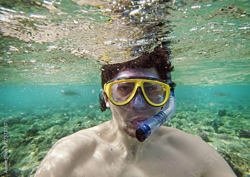 Photo: man with a goggles in the sea man with a goggles in the sea