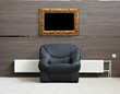 black chair with radiator and picture frame