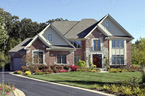 Photo: Brick home with front balcony Brick home with front balcony