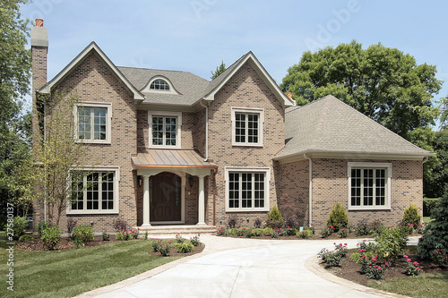 Photo: Luxury brick home with white columns Luxury brick home with white columns