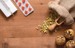 still life with herbs and pills